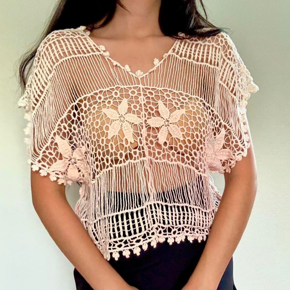 Cream crochet top with soft pink floral accents